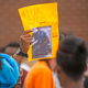 Minnesota protestor holds up a sign that reads #I Can’t Breath above a photo George Floyd being killed by the police.